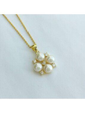 White cultured pearl pendant necklace with white Sapphire in 14k gold